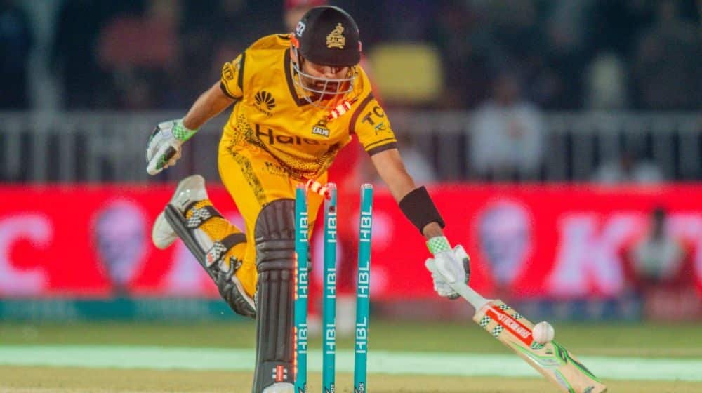 Babar Azam walking back to the pavilion after getting out for a duck during a PSL 10 match